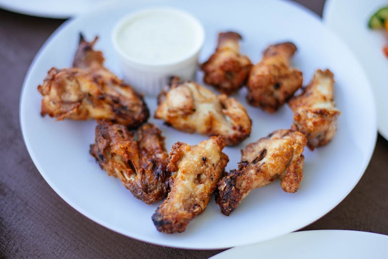 Crispy chicken wings with dipping sauce at Via 313