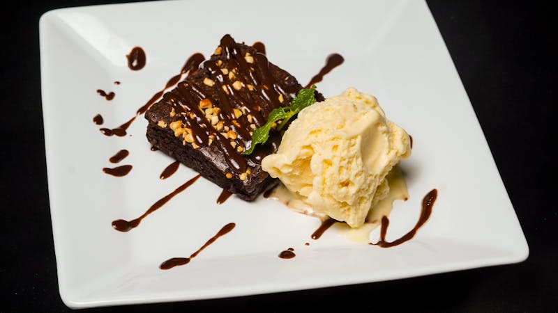 Chocolate brownie dessert with vanilla ice cream