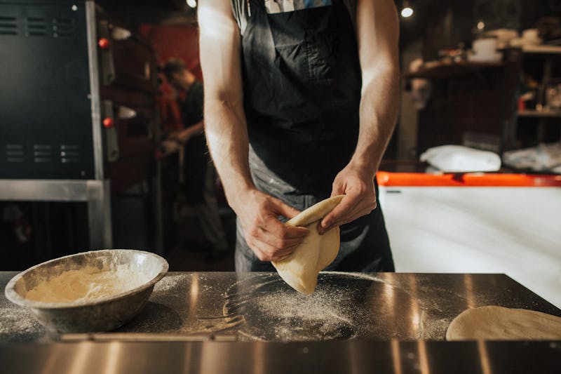 Via 313 restaurant interior with Detroit-style pizza being prepared